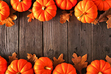 Autumn Double Border Of Pumpkins And Fall Leaves. Above View On A Rustic Wood Background With Copy Space.
