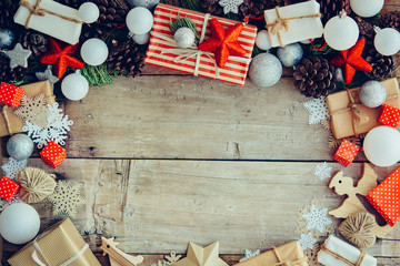 Wall Mural - Christmas background with gift boxes and decorations on the wood