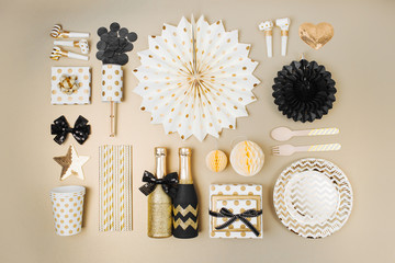 Wall Mural - Flat lay stylish set: champagne, gift, christmas balls and golden holiday decoration. Flat lay, top view.