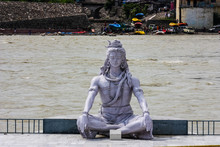 Smiling Statue Of Shiva On The Banks Of The Ganges In Rishikesh, Uttarakhand, India