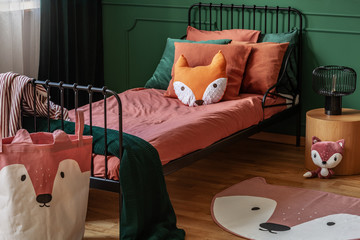 Fox shape like pillow and bag with fox head in elegant bedroom interior