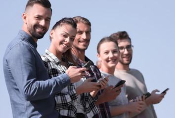 Sticker - group of young people with modern smartphones.