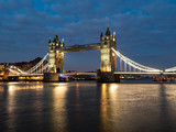 Fototapeta Londyn - Tower Bridge at night illuminated by floodlights.