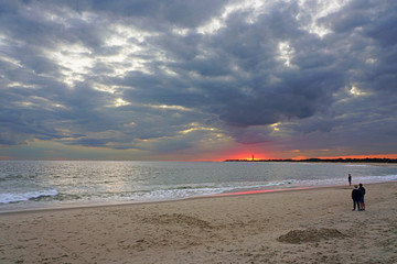 Wall Mural - Watching the sunset sky on the beach in Cape May, New Jersey, USA.