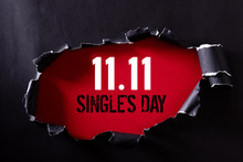 Online Shopping Of China, 11.11 Single's Day Sale Concept. Top View Of Black Torn Paper And The Text 11.11 Single's Day Sale On A Red Background.