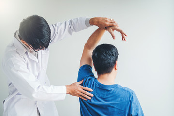 Wall Mural - Physical Doctor consulting with patient About Shoulder muscule pain problems Physical therapy diagnosing concept