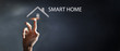 businessman presses smart home icon