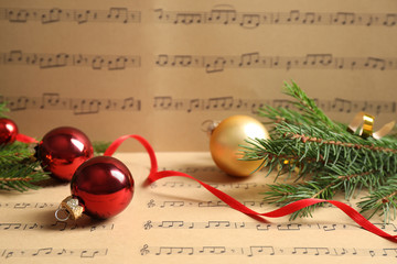 Sticker - Composition with Christmas decorations on music sheets