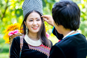 Young man takes care of the girlfriend with love and tenderness. Love , Friendship, Couple and Valentine concept. Hmong couple.