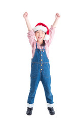 Wall Mural - Full length of little asian girl wearing santa claus hat rising hands up and smiles over white background