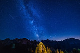 Fototapeta Kosmos - Mount Lussari. Clear and starry sky. Our galaxy. Milky Way. Italy