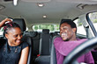 © AS Photo Family - Beautiful young african american couple sitting on the front passenger seats while handsome man driving a car.