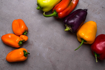 Wall Mural - Red, green, purple, orange, yellow sweet bell peppers natural background.