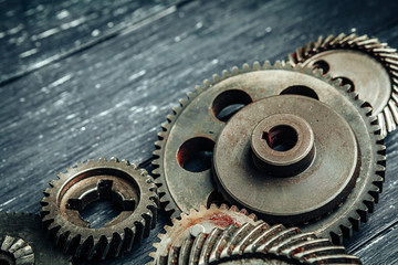 Wall Mural - Car parts gears and bearings on wooden background