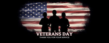 American National Holiday. US Flag Background With American Stars, Stripes And National Colors. Soldiers. Text: VETERANS DAY - Thank You For Your Service
