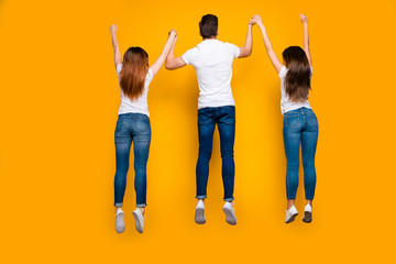 Sticker - Rear back behind full length body size view of three nice attractive friendly adorable slim fit thin sportive sporty person having fun free time isolated over bright vivid shine yellow background