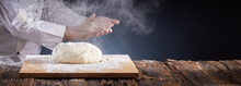 Chef Or Baker Dusting Dough With Flour