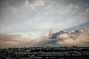 Wall Mural - Beautiful sunset view of Jerusalem Old City from the Mount of Olives. Sky with sun rays