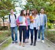 © Minerva Studio - Outdoor portrait of a group of students walking in the school park