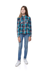 Teen girl in checkered shirt standing casually