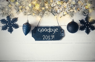 Wall Mural - Black Chirstmas Plate With English Text Goodbye 2019. Fir Branch With Fairy Lights On Wooden Background. Black Christmas Decoration Like Balls And Snowflakes.