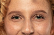 © master1305 - Beautiful young woman's eyes close-up shot. Female model with well-kept skin. Perfect skincare, human emotions, facial expression, beauty and cosmetics concept. Deep green color and eyebrows.