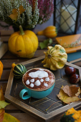 Poster - Cup of coffee with cinnamon on an open table