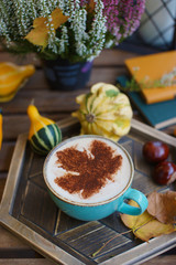 Sticker - Cup of coffee with cinnamon on an open table