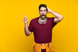 © luismolinero - Handsome young craftsman over isolated yellow background surprised and pointing finger to the side