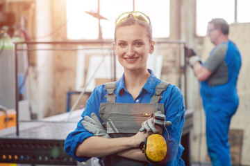 Wall Mural - Workers in a metal workshop