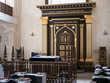 Synagogue inside interior with rows of benches for prayers