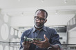 © ReeldealHD images - Closeup of African American adult male computer engineer holding motherboard