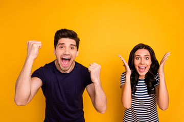 Poster - Portrait of his he her she nice attractive lovely cheerful cheery glad delighted overjoyed people married spouses having fun celebrating good news isolated over bright vivid shine yellow background