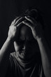© emodpk - Man are be serious and be strain black and white photo, portrait man are serious and headache in studio