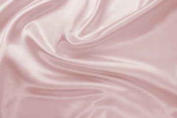 Delicate satin draped fabric pink texture for festive backgrounds