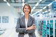 © Westend61 - Portrait of a smiling businesswoman in a modern factory