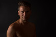 © IoaBal - Portrait of mature man with naked torso in split light