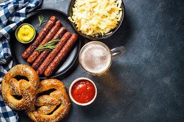 Wall Mural - Oktoberfest food - sausage, beer and bretzel.