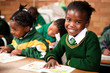 © Greatstock - A young girl sitting at a desk in a classroom, Meyerton Primary School, Meyerton, Gauteng