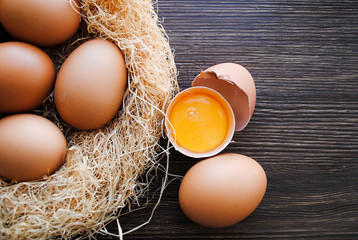 Wall Mural - Nest with brown chicken eggs.