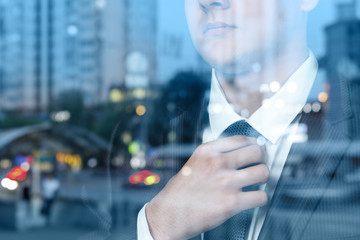 Wall Mural - Young businessman corrects a tie .