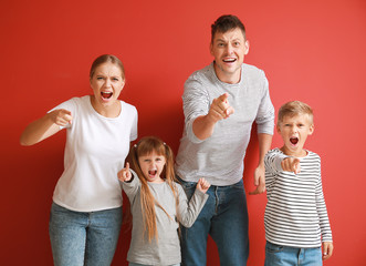 Poster - Portrait of angry family on color background