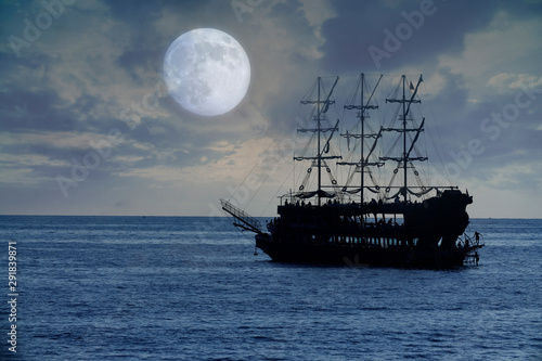 old pirate ship sailing, night at sea