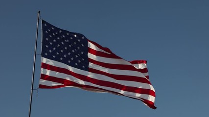 Wall Mural - Full HD Right Facing American Flag Slow Motion Waving In Wind With Ghosted Time-lapse Clouds