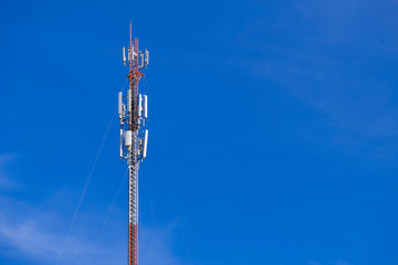 Telecommunication telephone signal transmission tower with beautiful blue sky background