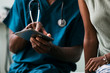 © Sean Locke Photography/Stocksy - Exam: Doctor Shows Patient Information On Digital Tablet