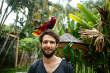 Young Man In The Bird Park