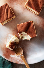 Sliced tiramisu on a plate, dessert in the afternoon