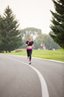 © Olga Mishyna - sport girl making exercises outdoors. Young sport woman in a park