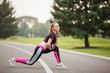 © Olga Mishyna - sport girl making exercises outdoors. Young sport woman in a park. Sport and fitness on open air
